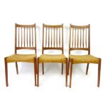 Three Danish teak and seacord dining chairs with spindle backs CONDITION REPORT: Good for age