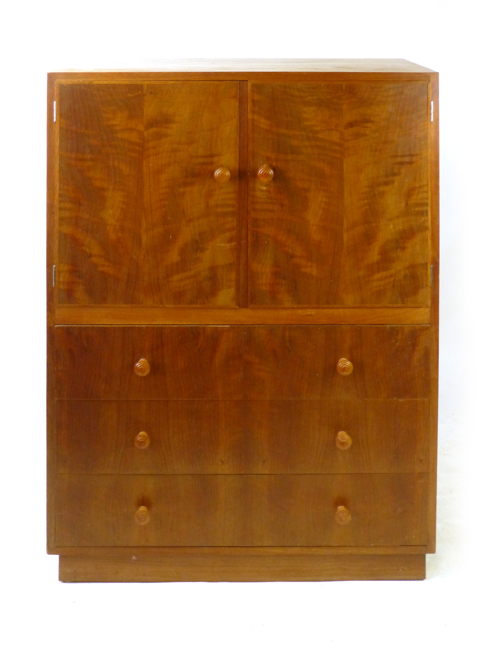 A 1950/60's walnut highboy, the two doors over three drawers on a plinth base, w. 91.4 cm