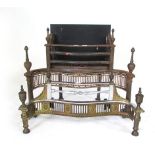 A Regency style steel and brass fireplace with serpentine front; together with another similar in