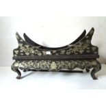 A Chinese lacquer and gilt painted stand of crescent form on a base with a wavy apron, l. 70 cm