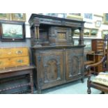 A late 17th century and later inlaid oak press cupboard, three panelled upper section under a