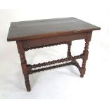 An 18th Century and later oak side table with four plank cleated top, block and bobbin turned legs