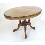 A Victorian walnut oval tilt top loo table with quadripartite base. w. 116 cm. CONDITION REPORT: Top