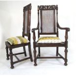 A set of eight Carolean style oak dining chairs with pierced and carved top rail, caned back,