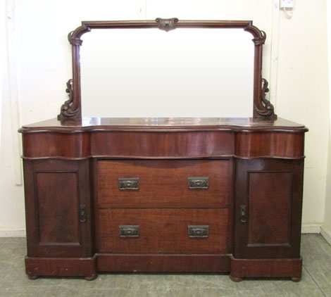 A late Victorian mahogany mirror backed sideboard, shaped rectangular mirror above a serpentine base