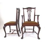 A set of eight Chippendale style mahogany dining chairs, serpentine top rail above a pierced