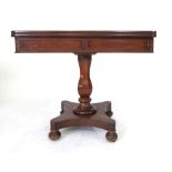 A 19th Century mahogany fold out tea table, panelled frieze, octagonal baluster column and