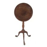 A 19th Century mahogany circular tilt top occasional table on a tripod base. h. 74 cm; together with