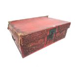 A Chinese tooled leather travelling trunk, the front decorated with dragons either side of the