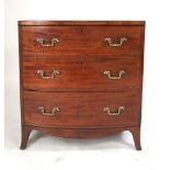 A 19th Century mahogany, cross banded, bow fronted chest of three graduated long drawers with