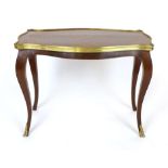 A French style walnut and inlaid occasional table, the floral top with brass rim, width 65cm