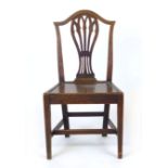 A George lll oak dining chair with pierced baluster splat and solid seat. CONDITION REPORT: Some