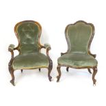 A matched pair of Victorian walnut framed chairs with spoon shaped backs, serpentine seats and