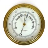 A brass aneroid barometer by John Barker of Kensington,