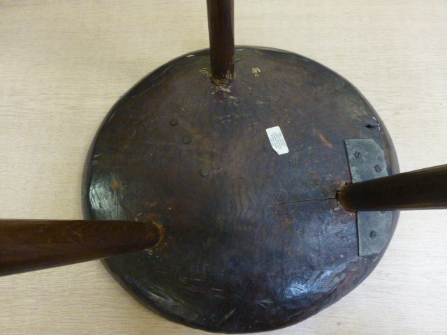 A primitive oak tripod table, adzed circular top on slightly tapering legs.  h. 49 cm, CONDITION - Image 5 of 6