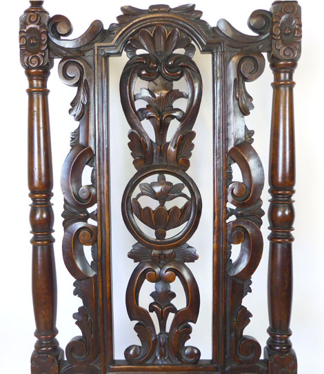 A Carolean style oak chair with scrolling, foliate, pierced back above a cane seat, turned legs - Image 3 of 3