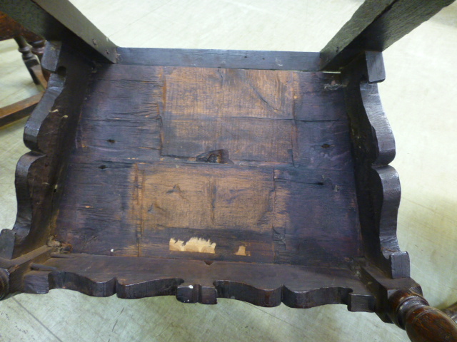An oak joined elbow chair, possibly late 16th Century, the back carved with the date 1591, flanked - Image 6 of 11