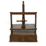 A Victorian book press, walnut with and ash handle, single drawer with brass swing handle. h. 82 cm,