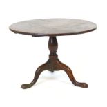 A George lll oak circular occasional table on turned column and tripod base, h. 54 cm, w. 76 cm,