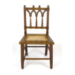 A Victorian oak bobbin turned hall chair, with caned seat
#VAT will be added to the hammer price