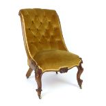 A Victorian walnut framed nursing chair, button back, serpentine seat, cabriole front legs CONDITION