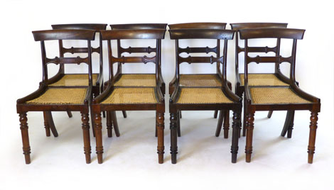 A set of eight William lV rosewood bar back dining chairs with cane seats,