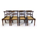 A set of eight William lV rosewood bar back dining chairs with cane seats,