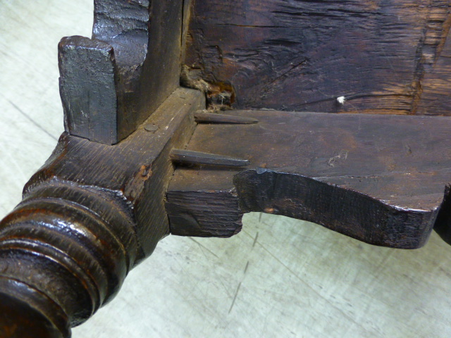 An oak joined elbow chair, possibly late 16th Century, the back carved with the date 1591, flanked - Image 8 of 11