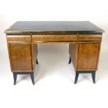 A Biedermeier style burr walnut and ebonised twin pedestal desk, three frieze drawers above two