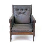 A mahogany framed elbow chair, probably early 19th century, turned back splats and later leather