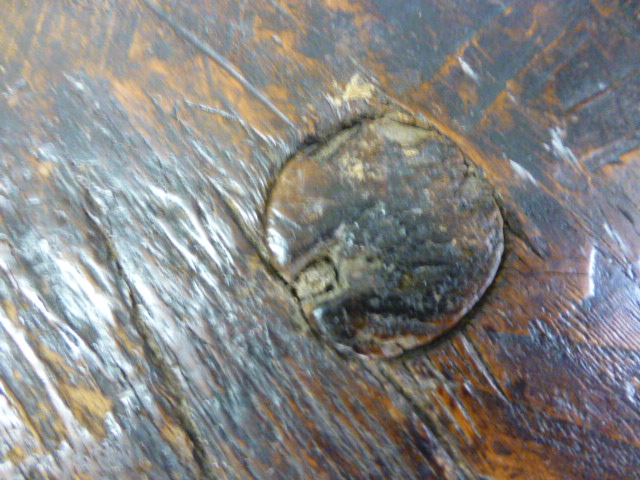 A primitive oak tripod table, adzed circular top on slightly tapering legs.  h. 49 cm, CONDITION - Image 4 of 6