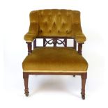 A Victorian mahogany framed easy chair, button back and stuffed over seat CONDITION REPORT: Joints