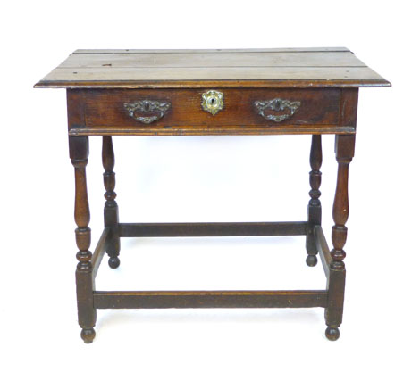 An oak low boy, 18th Century and later, rectangular panel top above a frieze drawer, baluster turned