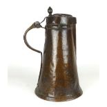 A copper ewer of Jack form, hinged cover with later turned thumb piece. h. 45 cm. CONDITION