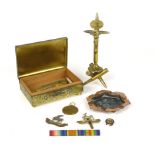 Trench Art: a bullet crucifix with Ypres plaque, a copper dish, Great War medal, cap badges,