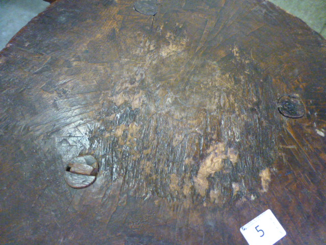 A primitive oak tripod table, adzed circular top on slightly tapering legs.  h. 49 cm, CONDITION - Image 2 of 6