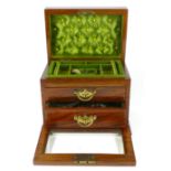 A Victorian mahogany jewellery casket, the cover enclosing a fitted interior, the glass fall front