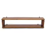 A Victorian mahogany wall hanging shelf unit with tapering octagonal supports. w. 140 cm.