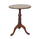 A mahogany circular tilt top occasional table, mid 19th century, baluster and tulip carved base.