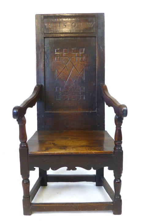 An oak joined elbow chair, possibly late 16th Century, the back carved with the date 1591, flanked - Image 2 of 11