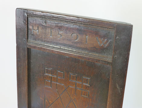 An oak joined elbow chair, possibly late 16th Century, the back carved with the date 1591, flanked - Image 4 of 11