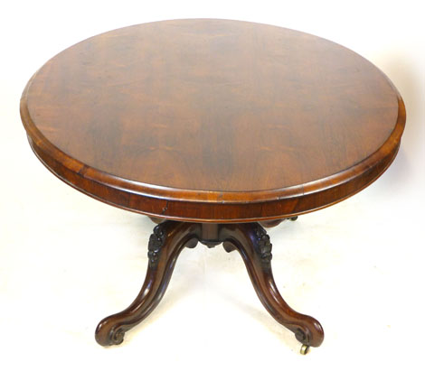 A Victorian rosewood oval tilt top breakfast table, raised on a foliate carved quadripartite - Image 3 of 4