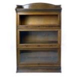 The Lebus oak globe wernick style three tier bookcase. h. 120 cm
 CONDITION REPORT: Good with some