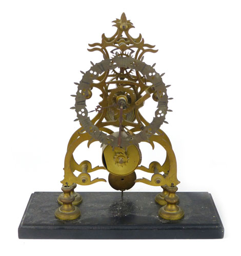 A 19th Century brass skeleton clock with single fusee movement. h. 30 cm. CONDITION REPORT: