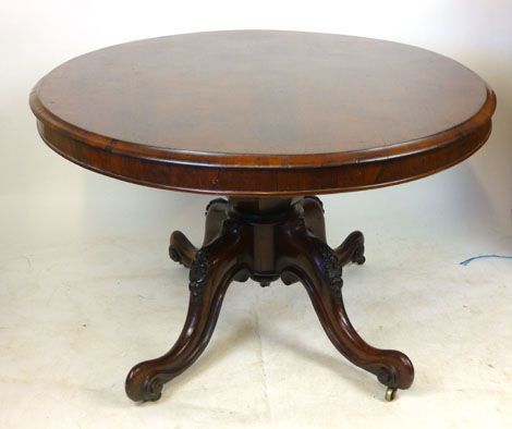 A Victorian rosewood oval tilt top breakfast table, raised on a foliate carved quadripartite - Image 2 of 4