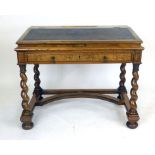 A Victorian walnut clerk's desk with a leather inset writing slope enclosing a vacant interior,