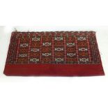 A near pair of Turkman Kilim weave bags banded geometric decoration on a madder ground,