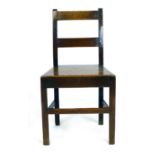 A George III oak dining chair with solid seat  CONDITION REPORT: Generally good some joints loose,