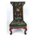 A Victorian walnut prie dieu with tapestry upholstery CONDITION REPORT: Upholstery not original