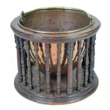 A Victorian mahogany and copper coal scuttle, the frame with bobbin turned supports holding a bucket
